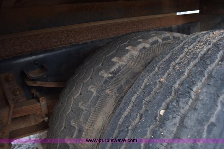 image for item K6053 1999 Ford F700 flatbed truck