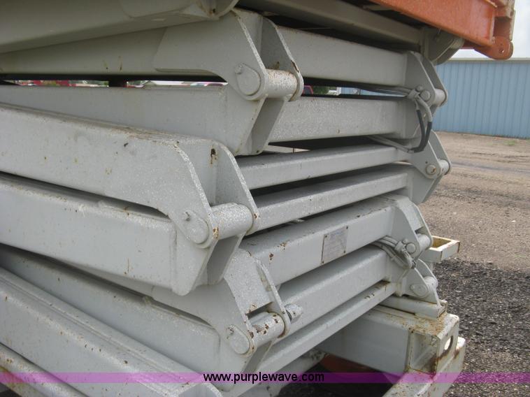 image for item K8689 1999 Sky Jack SJ8841A scissor lift