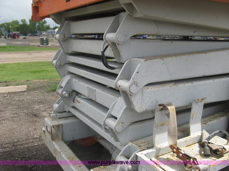image for item K8689 1999 Sky Jack SJ8841A scissor lift