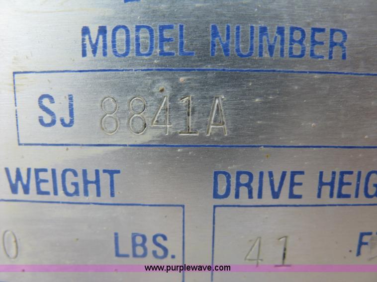 image for item K8689 1999 Sky Jack SJ8841A scissor lift