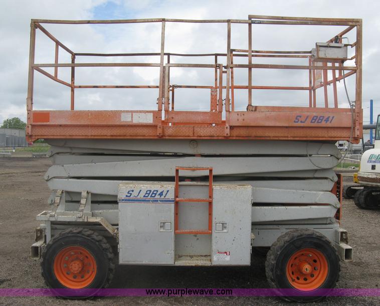 image for item K8690 1999 Sky Jack SJ8841A scissor lift