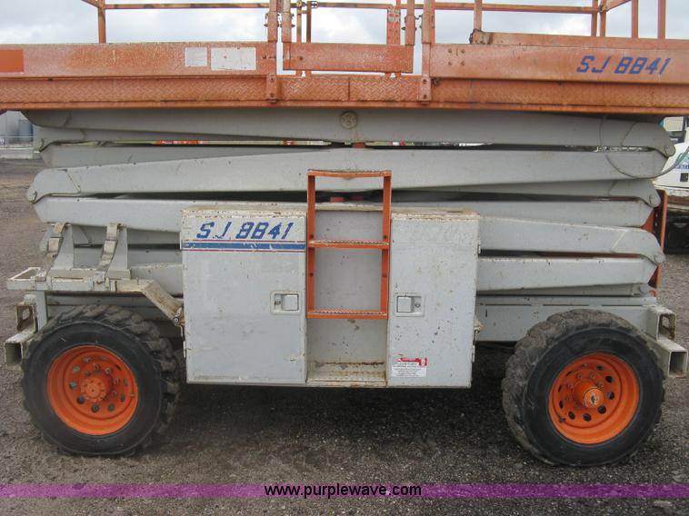 image for item K8690 1999 Sky Jack SJ8841A scissor lift