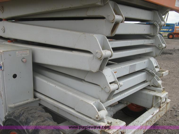 image for item K8690 1999 Sky Jack SJ8841A scissor lift