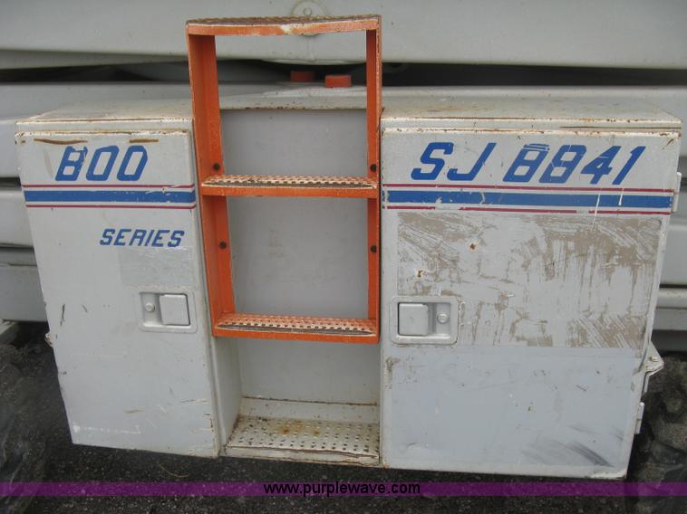 image for item K8690 1999 Sky Jack SJ8841A scissor lift