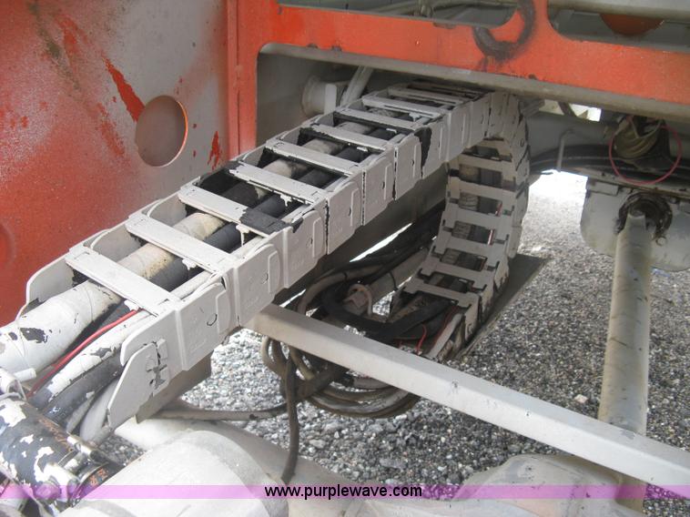 image for item K8690 1999 Sky Jack SJ8841A scissor lift