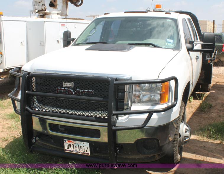 image for item L4299 2012 GMC Sierra 3500HD Crew Cab flatbed utility truck