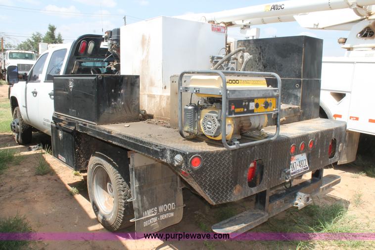 image for item L4299 2012 GMC Sierra 3500HD Crew Cab flatbed utility truck