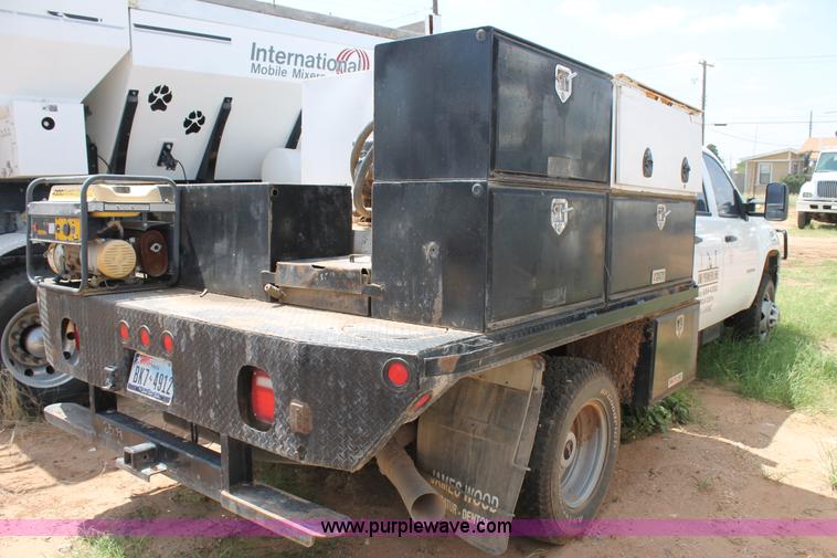 image for item L4299 2012 GMC Sierra 3500HD Crew Cab flatbed utility truck