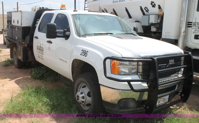 image for item L4299 2012 GMC Sierra 3500HD Crew Cab flatbed utility truck