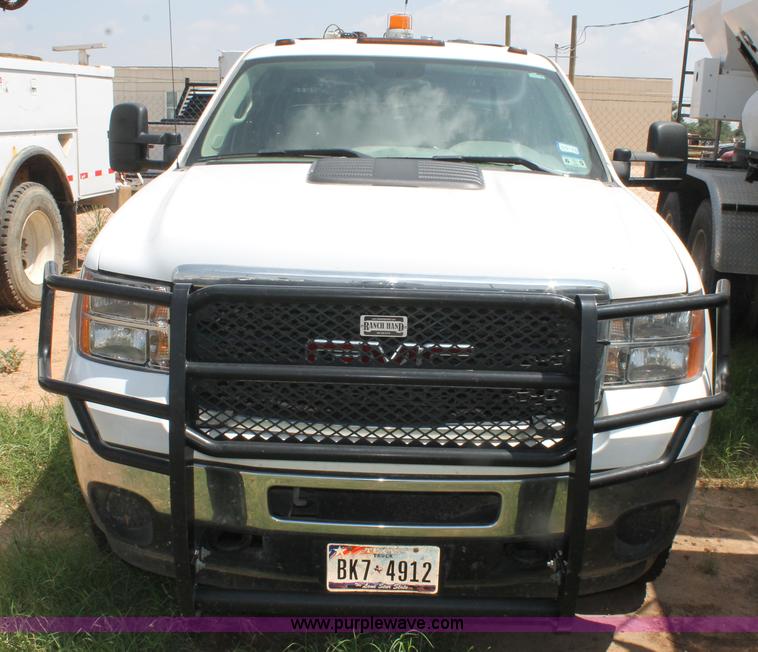 image for item L4299 2012 GMC Sierra 3500HD Crew Cab flatbed utility truck