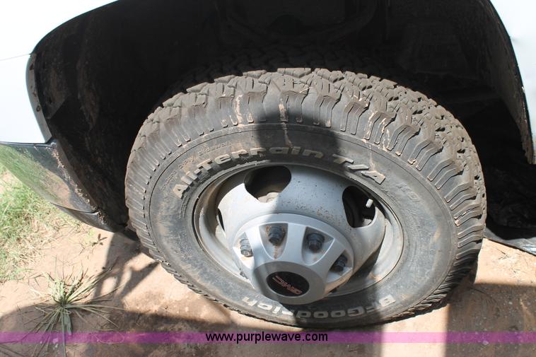 image for item L4299 2012 GMC Sierra 3500HD Crew Cab flatbed utility truck