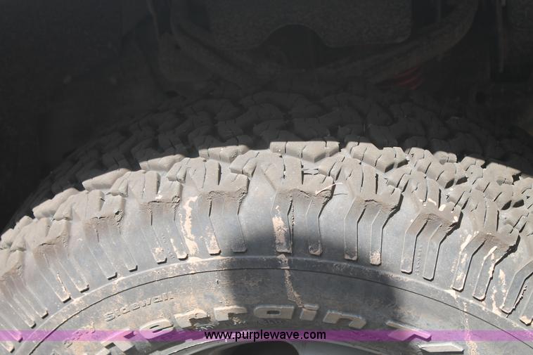 image for item L4299 2012 GMC Sierra 3500HD Crew Cab flatbed utility truck