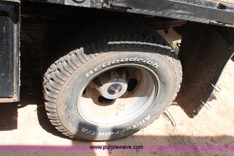 image for item L4299 2012 GMC Sierra 3500HD Crew Cab flatbed utility truck