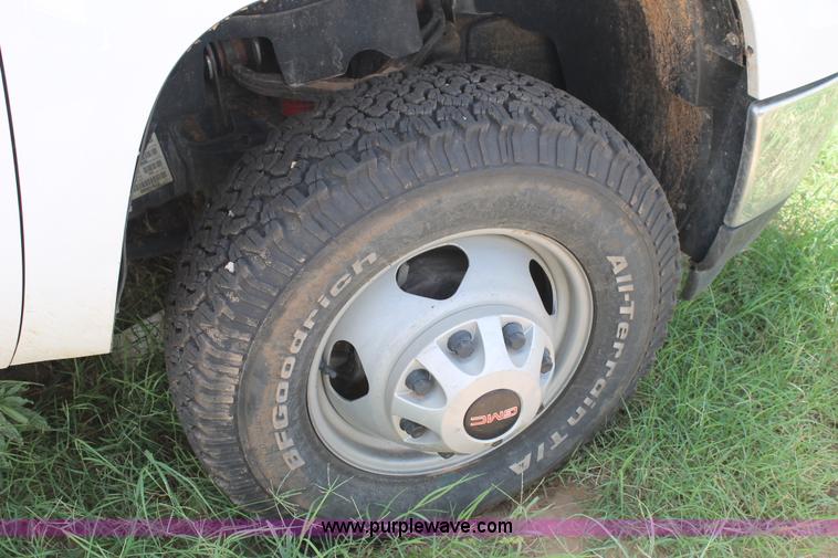 image for item L4299 2012 GMC Sierra 3500HD Crew Cab flatbed utility truck