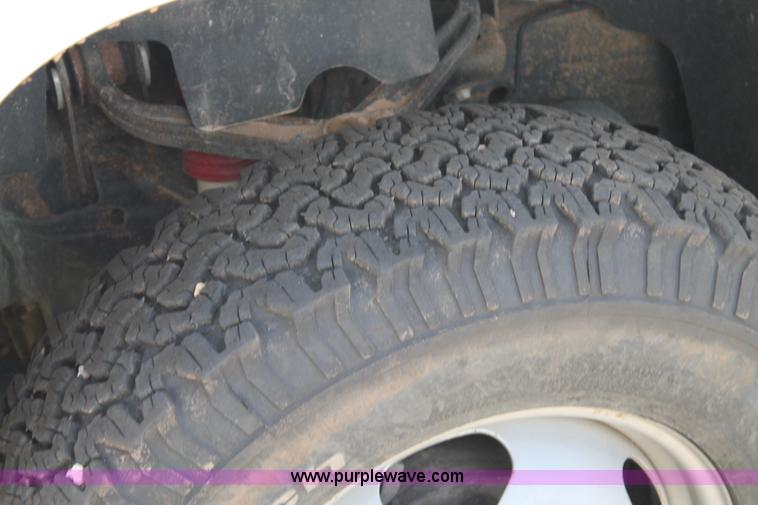 image for item L4299 2012 GMC Sierra 3500HD Crew Cab flatbed utility truck