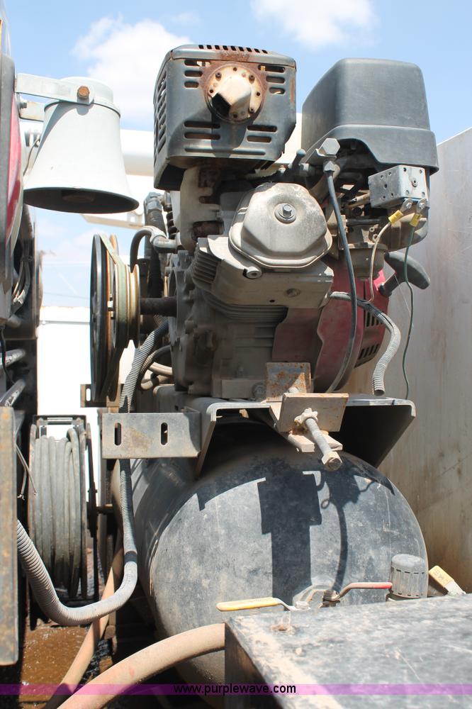 image for item L4299 2012 GMC Sierra 3500HD Crew Cab flatbed utility truck