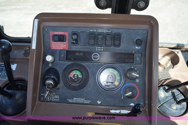 image for item L2565 1997 John Deere 310SE backhoe