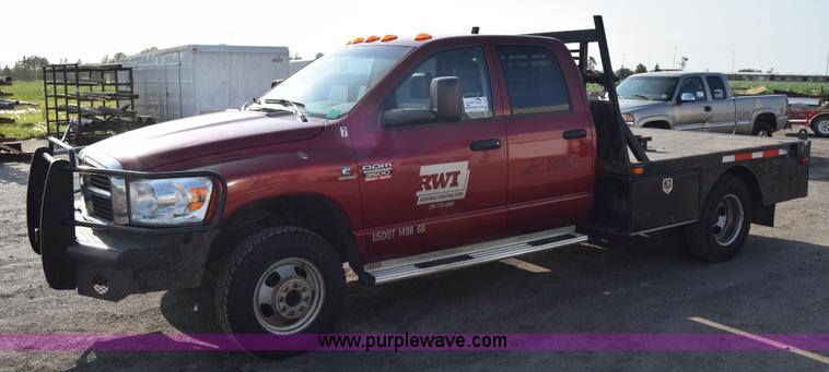 image for item L2578 2007 Dodge Ram 3500 Quad Cab flatbed pickup truck