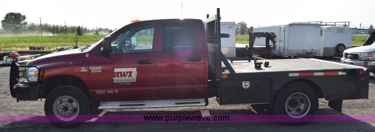 image for item L2578 2007 Dodge Ram 3500 Quad Cab flatbed pickup truck