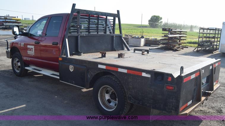 image for item L2578 2007 Dodge Ram 3500 Quad Cab flatbed pickup truck