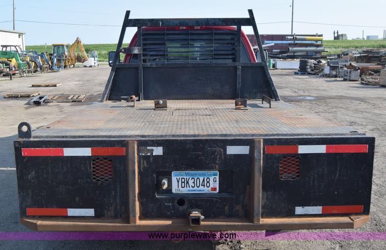 image for item L2578 2007 Dodge Ram 3500 Quad Cab flatbed pickup truck