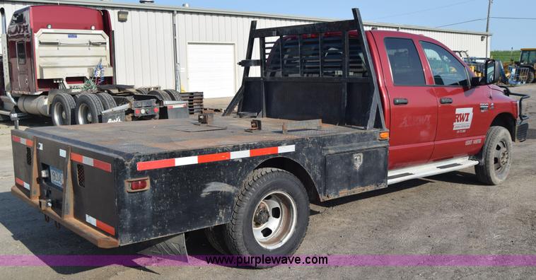 image for item L2578 2007 Dodge Ram 3500 Quad Cab flatbed pickup truck