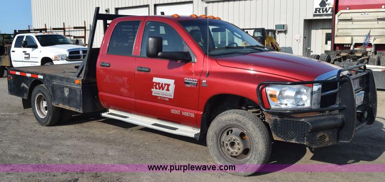 image for item L2578 2007 Dodge Ram 3500 Quad Cab flatbed pickup truck