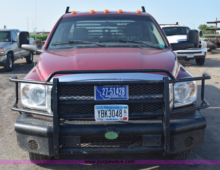image for item L2578 2007 Dodge Ram 3500 Quad Cab flatbed pickup truck