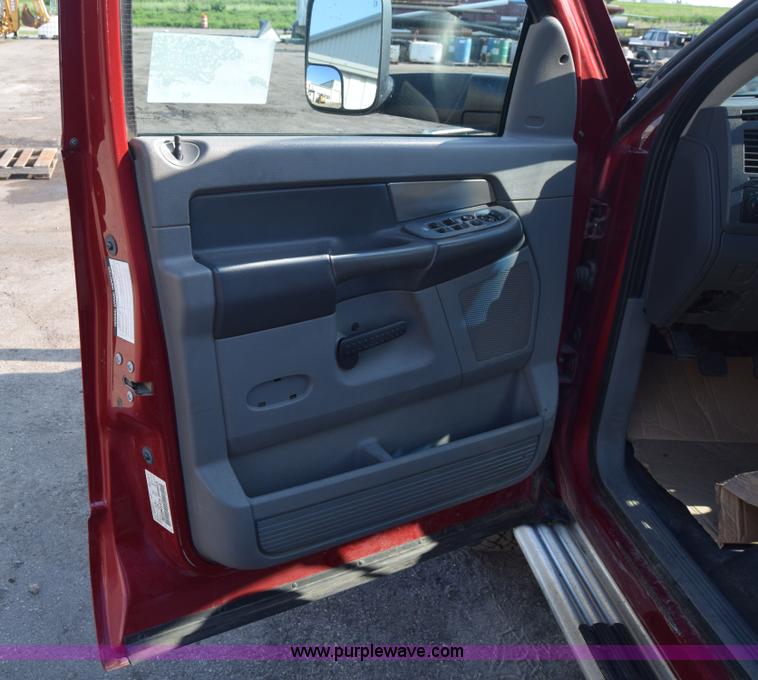 image for item L2578 2007 Dodge Ram 3500 Quad Cab flatbed pickup truck