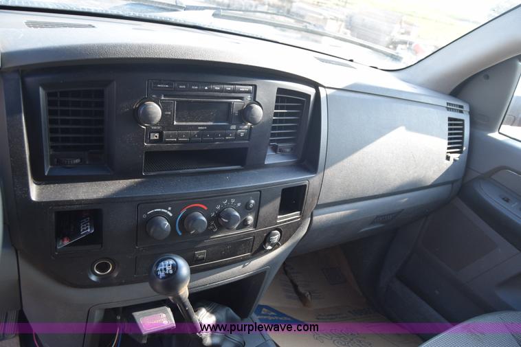 image for item L2578 2007 Dodge Ram 3500 Quad Cab flatbed pickup truck