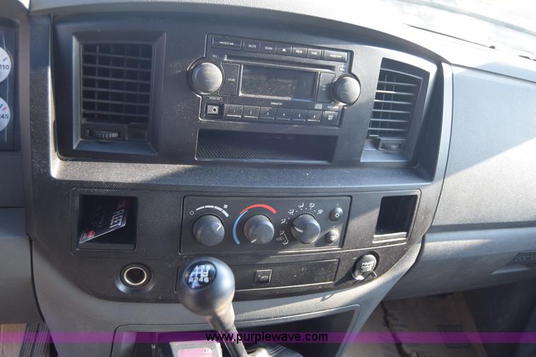 image for item L2578 2007 Dodge Ram 3500 Quad Cab flatbed pickup truck