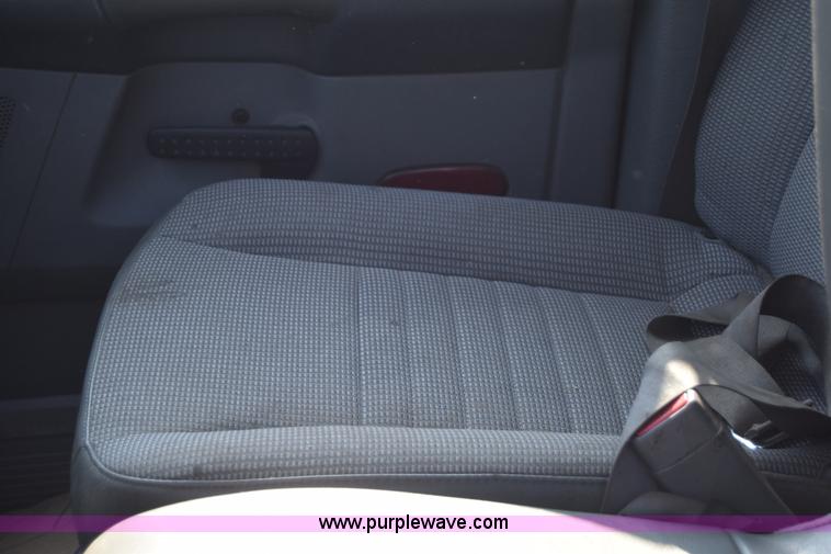 image for item L2578 2007 Dodge Ram 3500 Quad Cab flatbed pickup truck