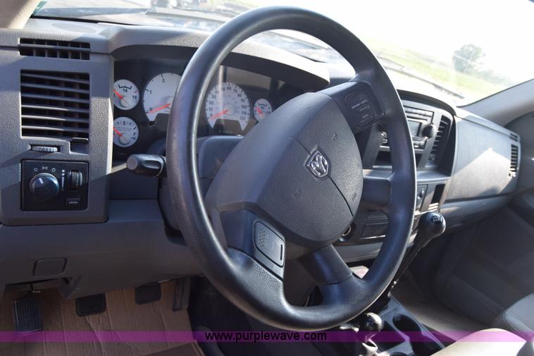 image for item L2578 2007 Dodge Ram 3500 Quad Cab flatbed pickup truck