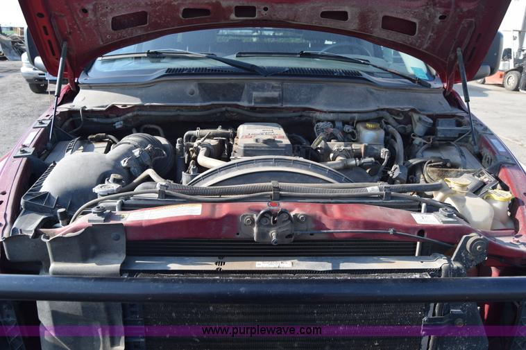 image for item L2578 2007 Dodge Ram 3500 Quad Cab flatbed pickup truck