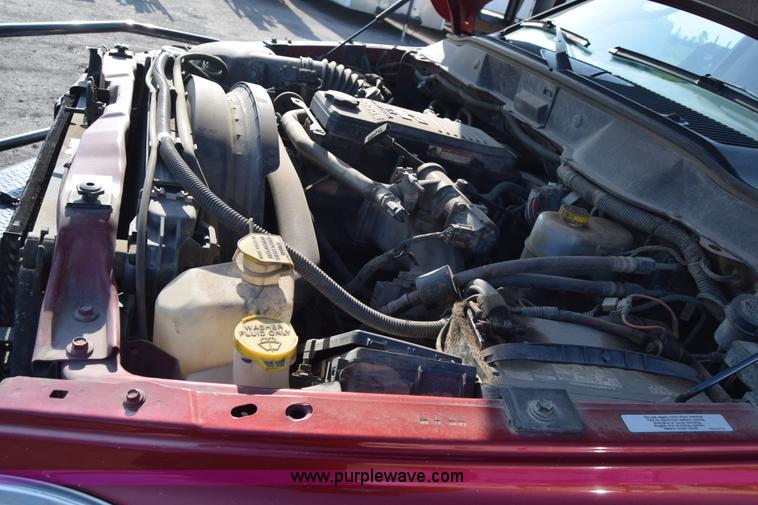 image for item L2578 2007 Dodge Ram 3500 Quad Cab flatbed pickup truck