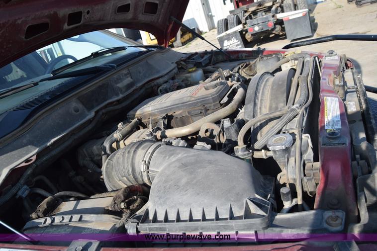 image for item L2578 2007 Dodge Ram 3500 Quad Cab flatbed pickup truck