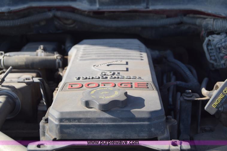 image for item L2578 2007 Dodge Ram 3500 Quad Cab flatbed pickup truck