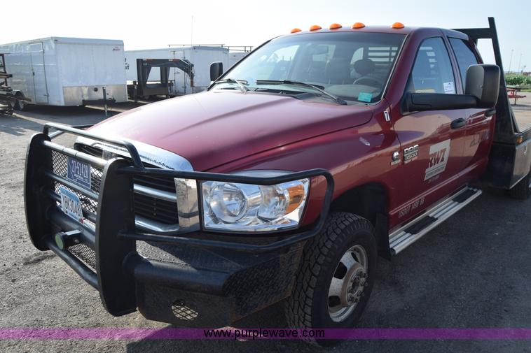 image for item L2578 2007 Dodge Ram 3500 Quad Cab flatbed pickup truck