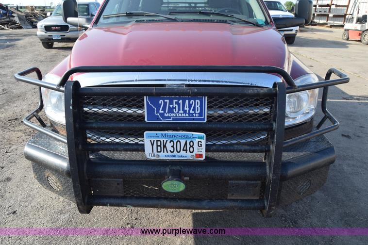 image for item L2578 2007 Dodge Ram 3500 Quad Cab flatbed pickup truck