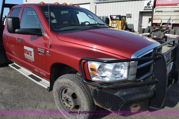 image for item L2578 2007 Dodge Ram 3500 Quad Cab flatbed pickup truck
