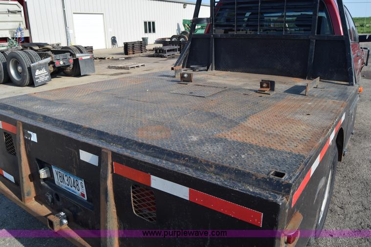 image for item L2578 2007 Dodge Ram 3500 Quad Cab flatbed pickup truck