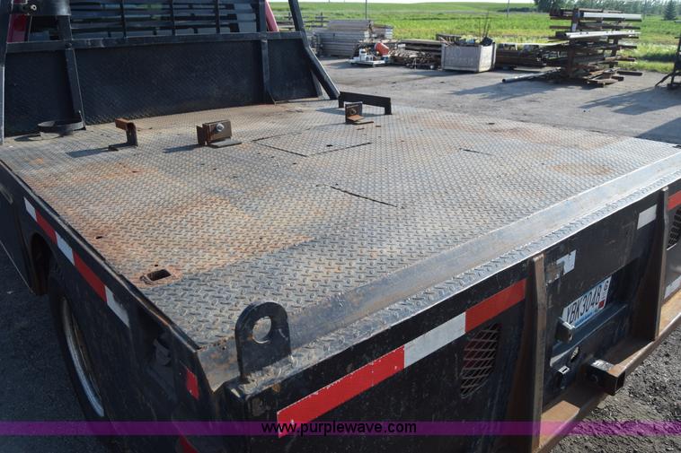 image for item L2578 2007 Dodge Ram 3500 Quad Cab flatbed pickup truck