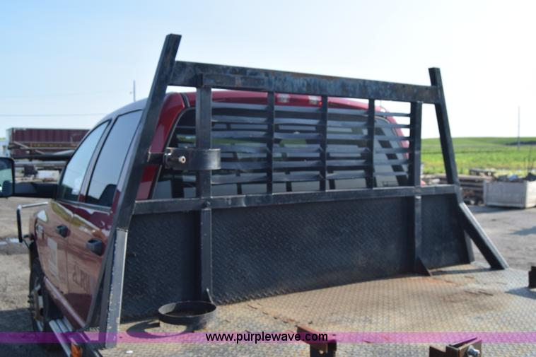 image for item L2578 2007 Dodge Ram 3500 Quad Cab flatbed pickup truck