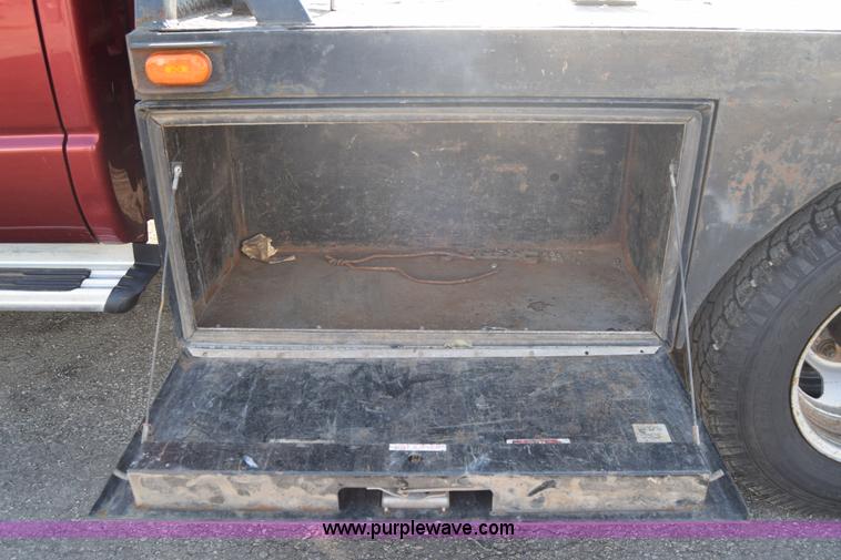 image for item L2578 2007 Dodge Ram 3500 Quad Cab flatbed pickup truck