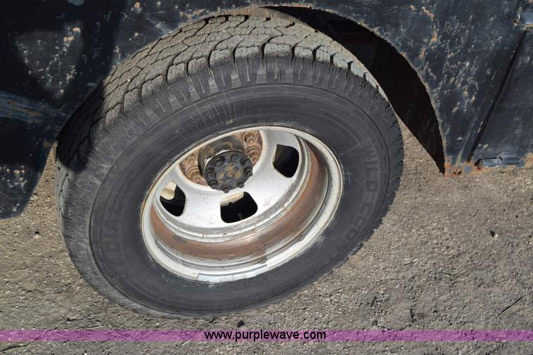 image for item L2578 2007 Dodge Ram 3500 Quad Cab flatbed pickup truck