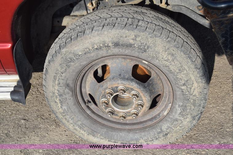 image for item L2578 2007 Dodge Ram 3500 Quad Cab flatbed pickup truck