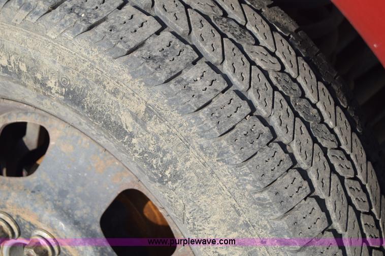 image for item L2578 2007 Dodge Ram 3500 Quad Cab flatbed pickup truck