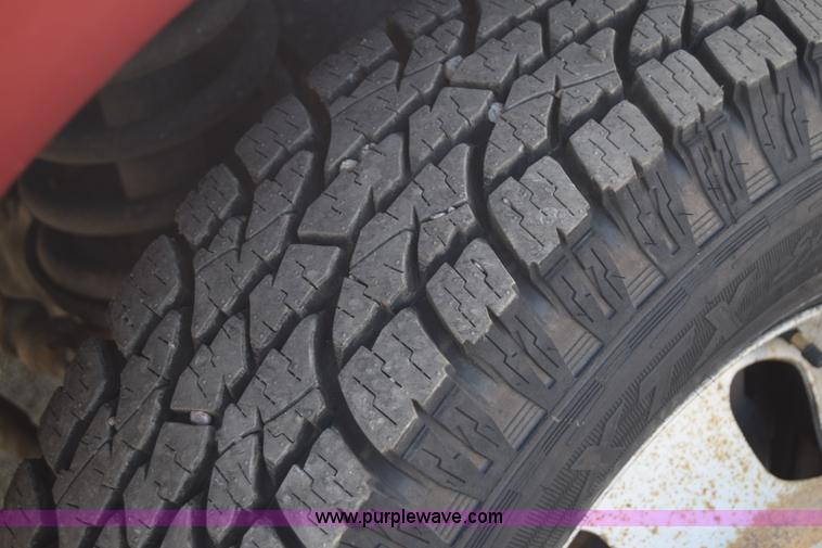 image for item L2578 2007 Dodge Ram 3500 Quad Cab flatbed pickup truck