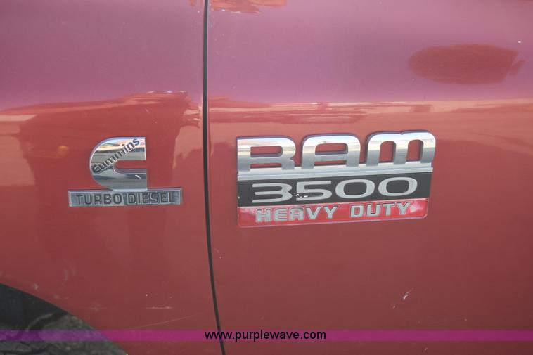 image for item L2578 2007 Dodge Ram 3500 Quad Cab flatbed pickup truck