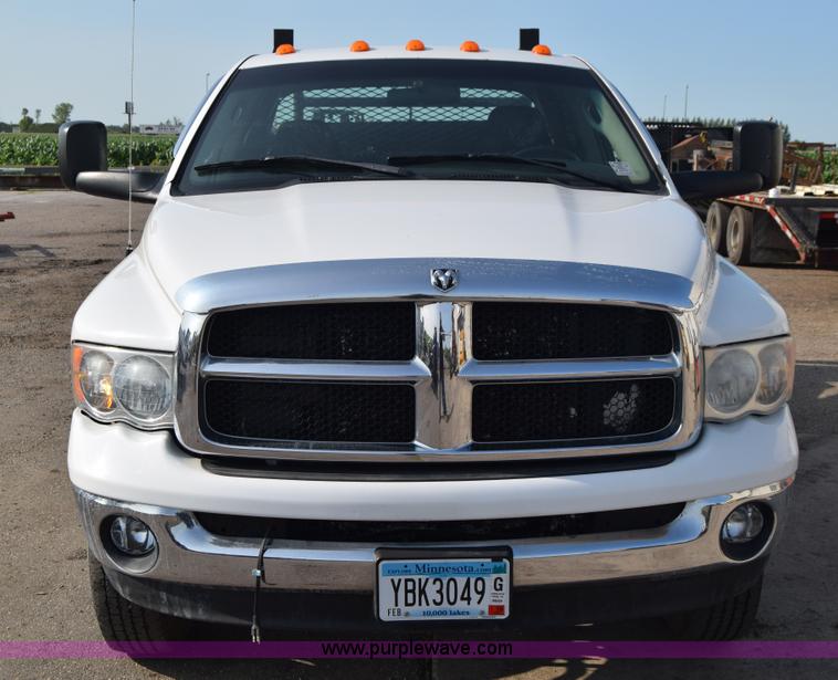 image for item L2579 2004 Dodge Ram 3500 Quad Cab flatbed pickup truck